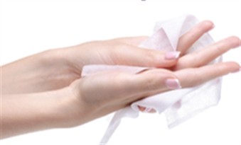 Cleansing hands with a Clinigo Hands & Face wipe